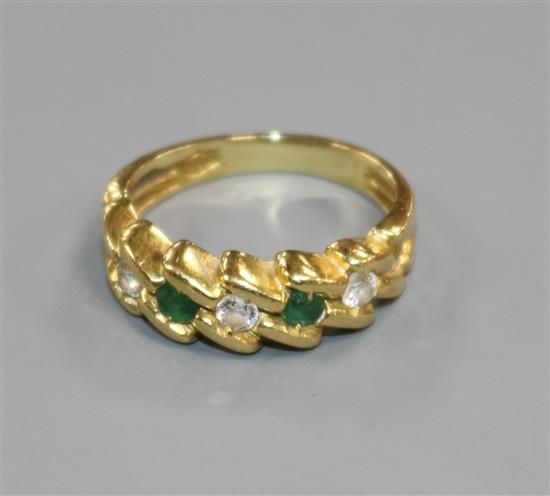 A modern 18ct gold, five stone emerald and diamond set half hoop ring, size F/G.
